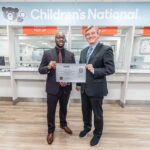 President and CEO, Shawn Griffin, MD presents Children's National Hospital with their Specialty Pharmacy Accreditation Certificate